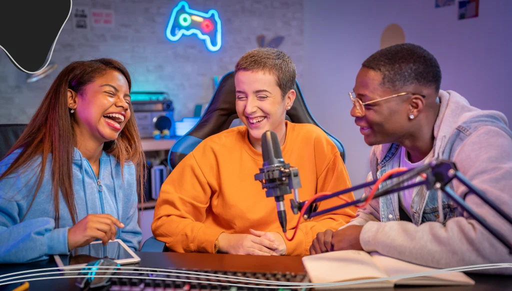 Young happy multiracial people performing at radio program making podcast recording for online show