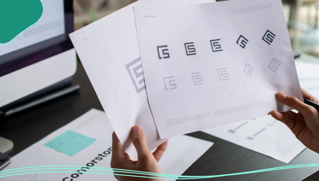 Graphic designer drawing sketches logo design