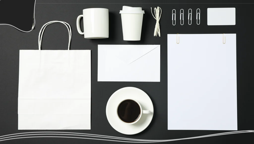 Flat lay composition with blank stationery on black background